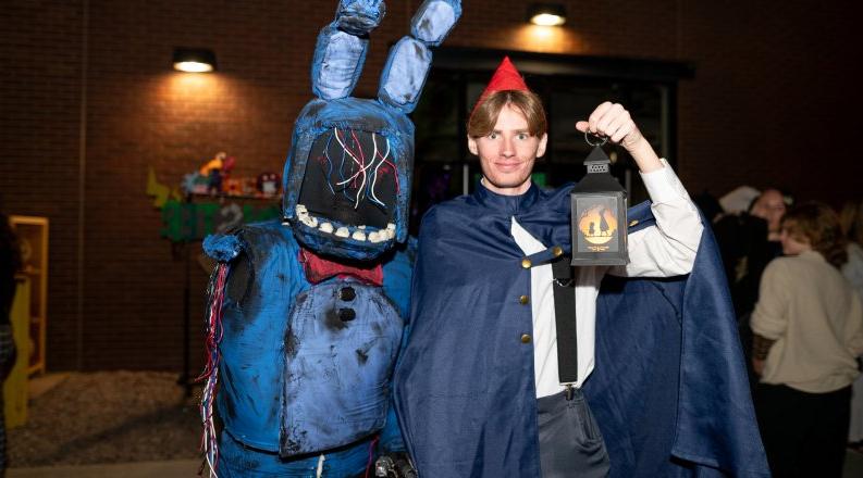 Two people in halloween costumes.